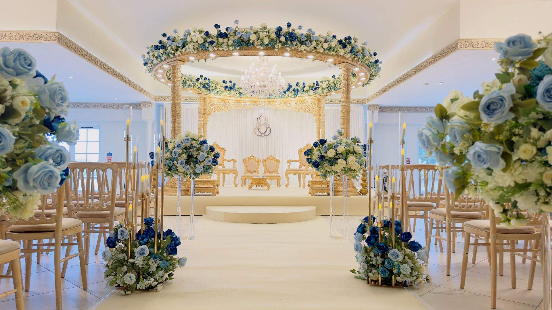 A blue & gold Asian Wedding Mandap setup in Froyle Park's Grand Ballroom.