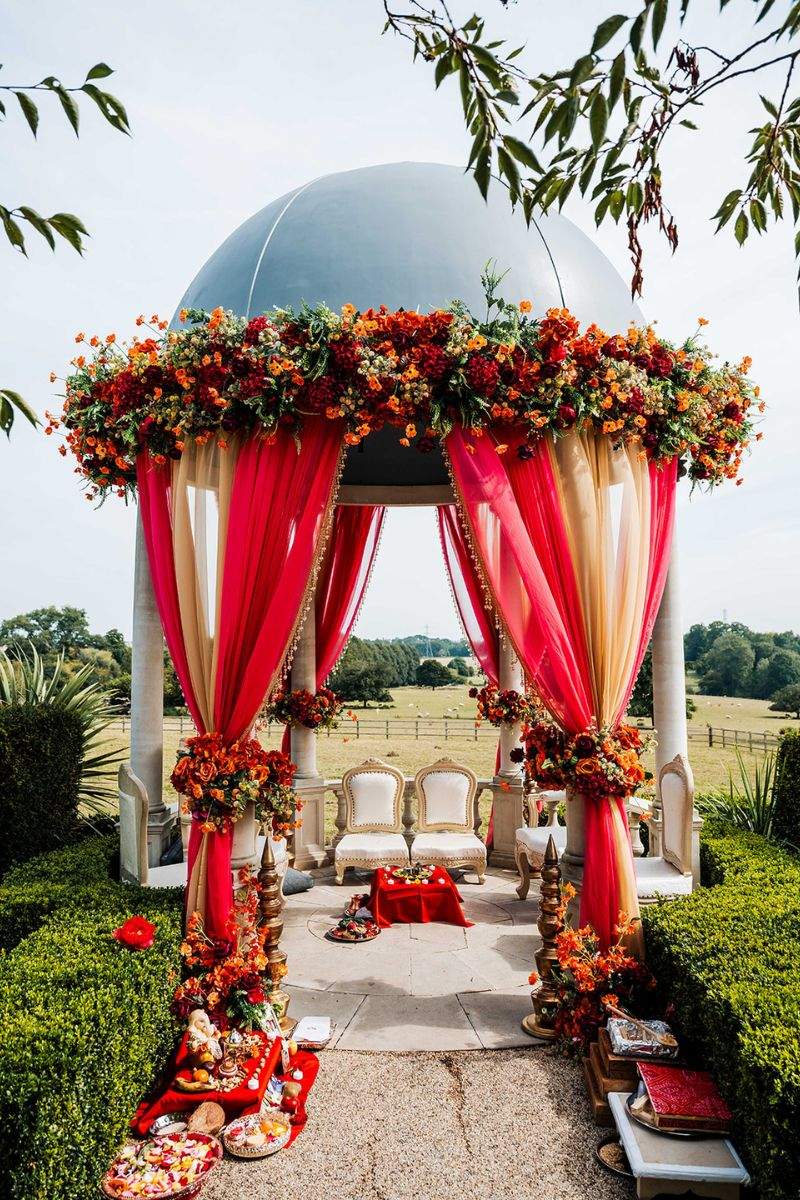 Froyle Park in Surrey's outdoor dome setup for a colourful Asian wedding featuring a Hindu Mandap