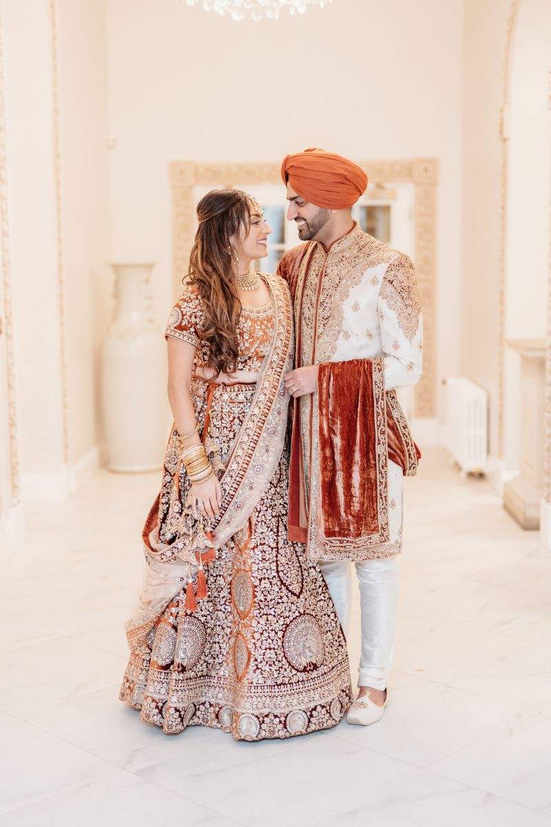 A Sikh Bride & Groom in cultural attire at Froyle Park, Surrey's leading Sikh wedding reception venue