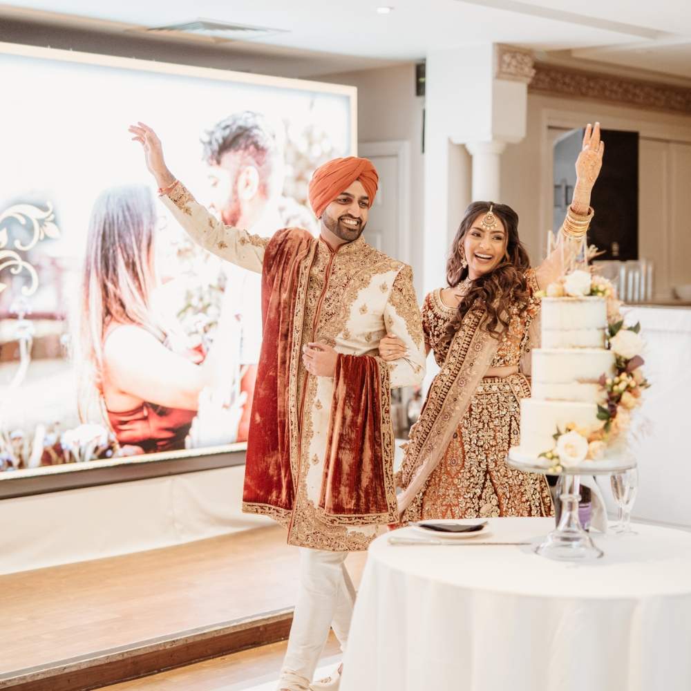 A Sikh Bride & Groom celebrating their Sikh wedding reception at Froyle Park, dressed in cultural Sikh attire
