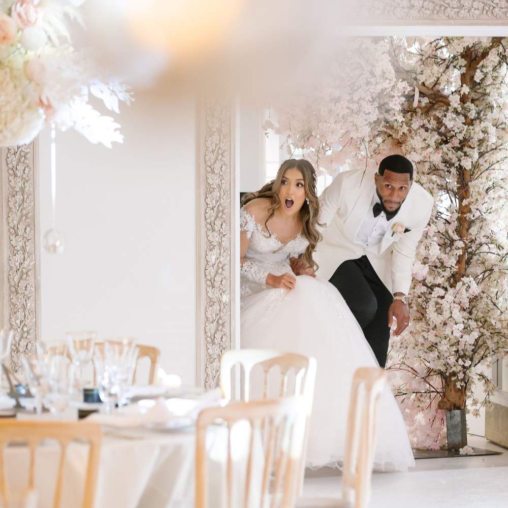 A Bride and Groom enter the Grand Ballroom at Froyle Park to marvel at their stunning decor