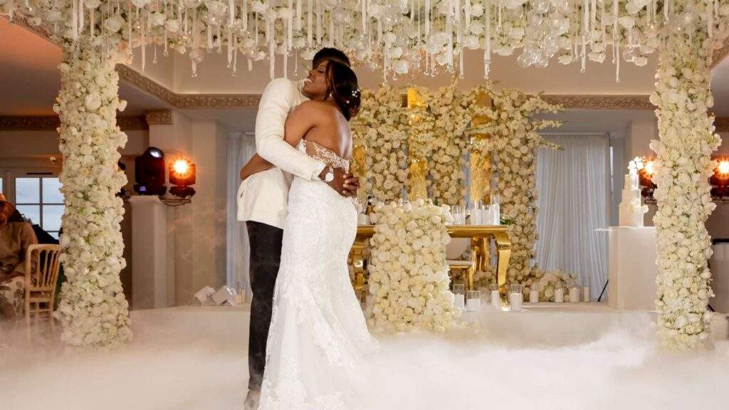 An Afro-Caribbean Bride & Groom dance on the clouds during their first dance at Froyle Park following their wedding ceremony.