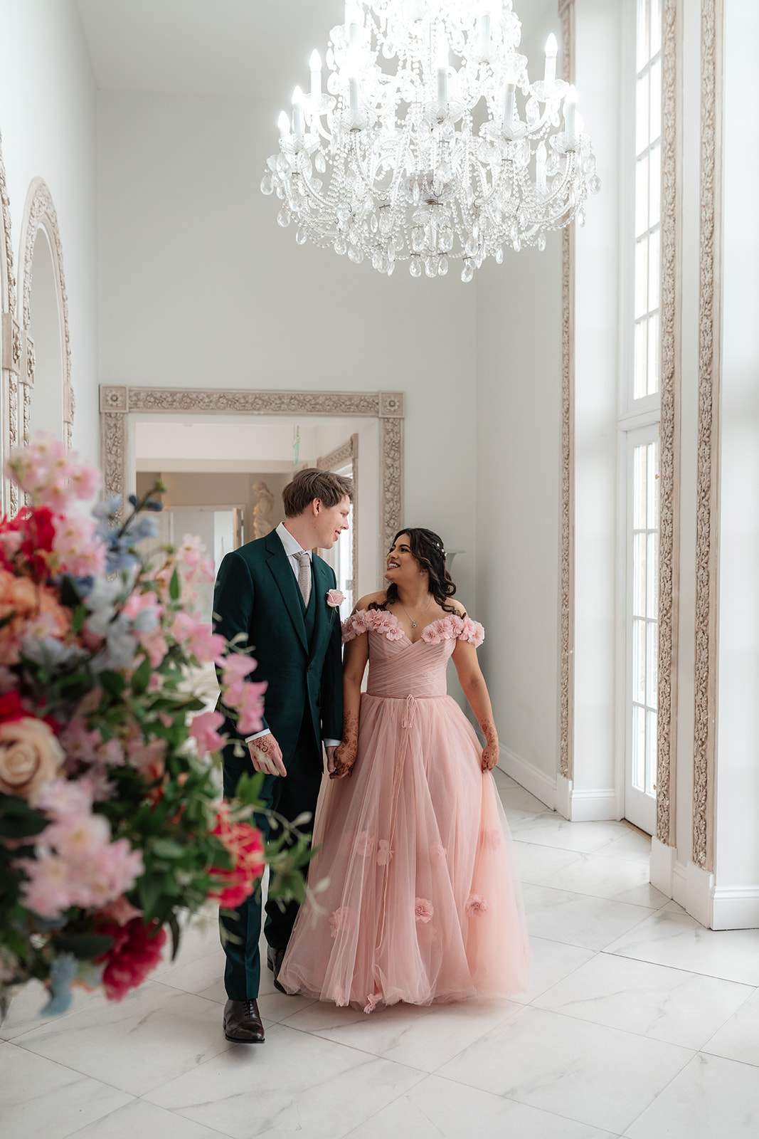 A bride and groom in the light and airy Ballroom Walkway at Froyle Park