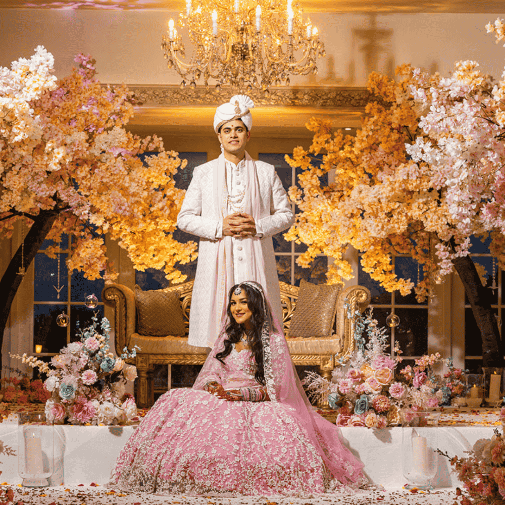 A stylish Hindu bride and groom in their open Mandap in The Grand Ballroom at Froyle Park