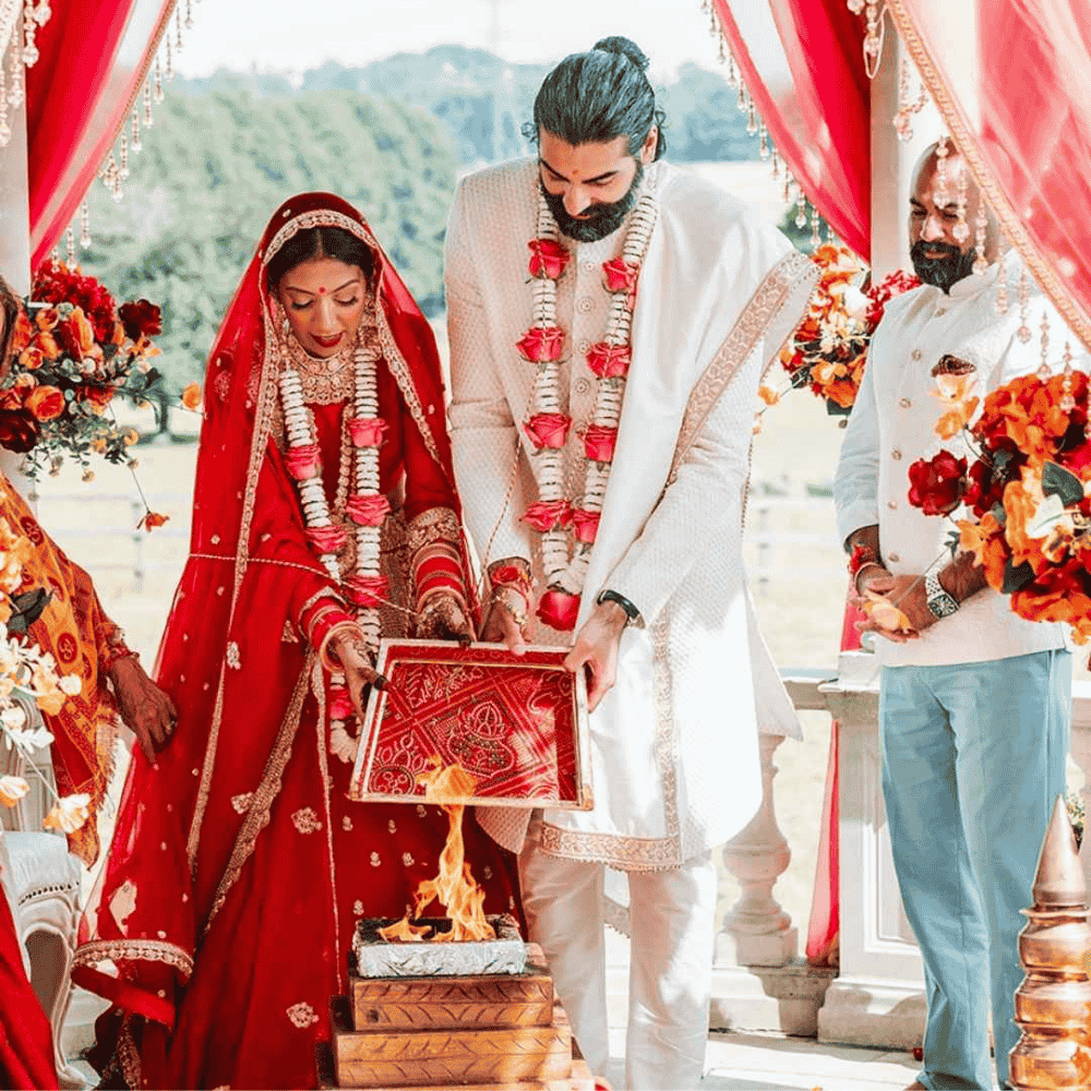A ceremonnial fire at a outdoor hindu wedding mandap setup at Froyle Park in Surrey