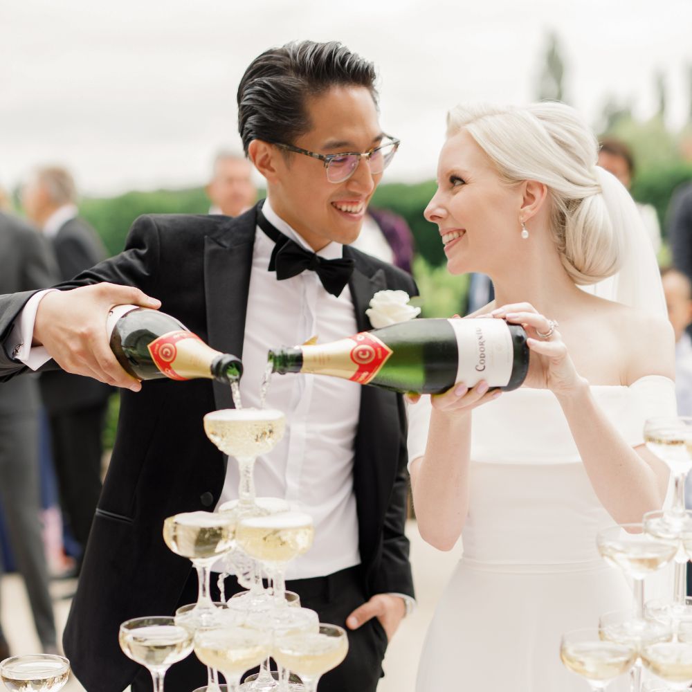 A Froyle Park Bride & Groom take full advantage of the Venue's no corkage policy by indulging in a decadent Champagne Tower - a new wedding trend!