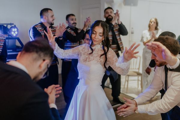A Lebanese bride dances at her wedding reception at Froyle Park in Hampshire