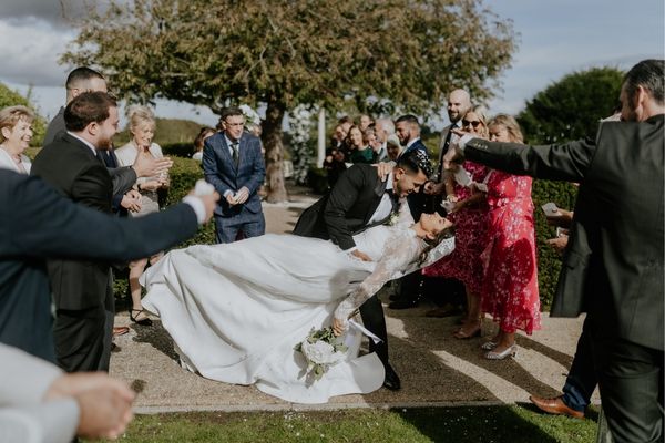 A Lebanese bride and groom following their outdoor ceremony at Froyle Park in Hampshire