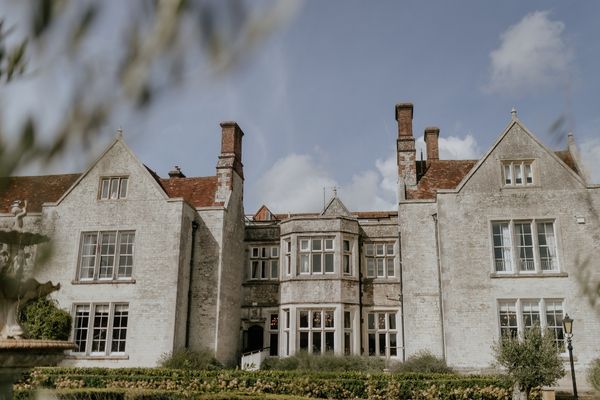 The stunning manor house at Froyle Park Wedding Venue as seen from the gardens