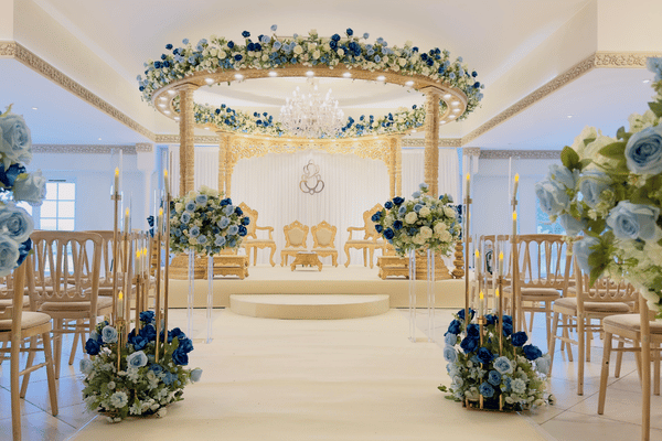 A decorative Hindu Mandap setup within the Grand Ballroom at Froyle Park, a Hindu wedding venue in Surrey.